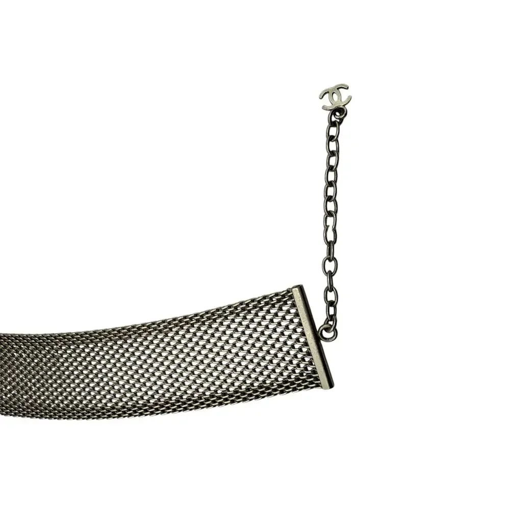 CHANEL Camellia with mesh silver choker collar.